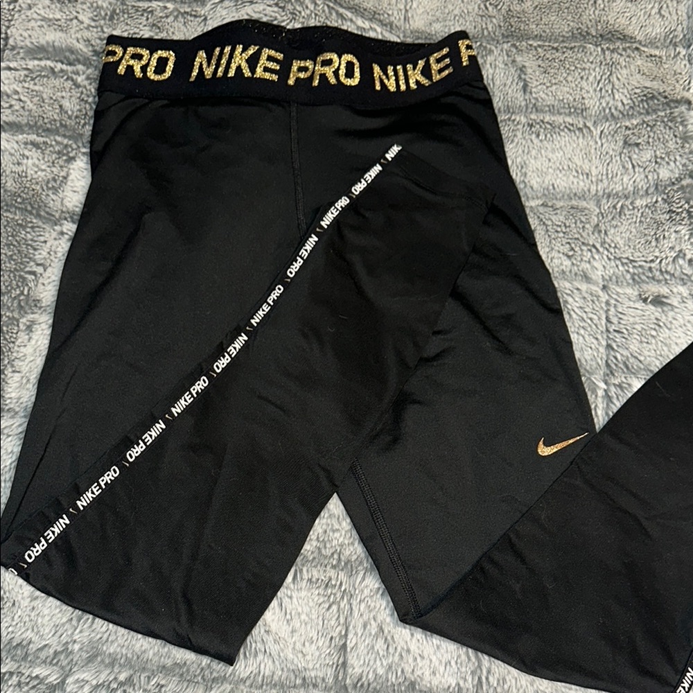 Nike Women’s Black and Gold Pro Leggings
